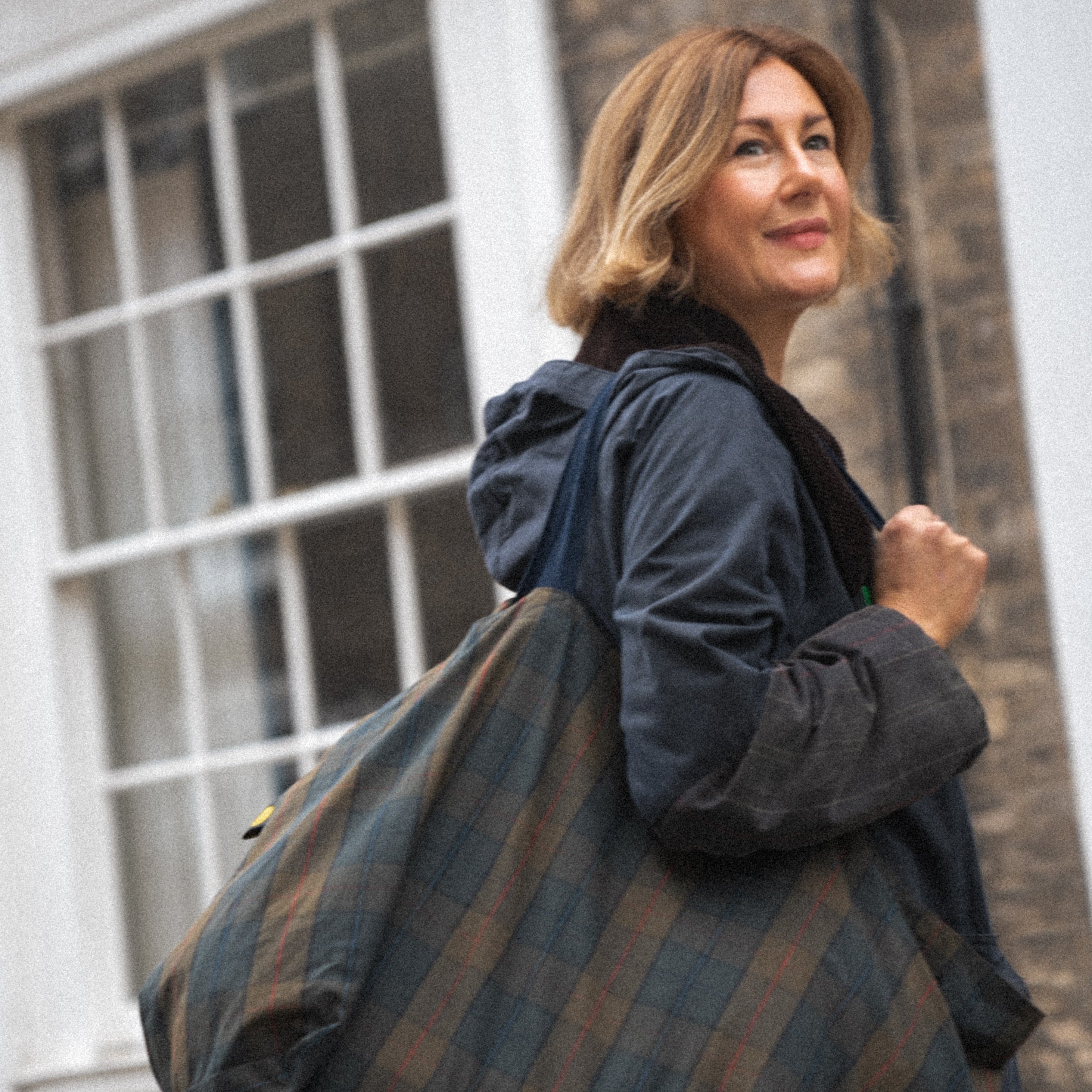 woman carrying waxed cotton bag